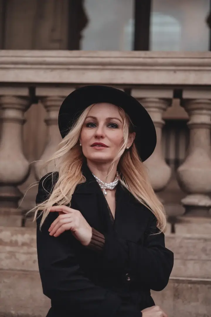 Blonde woman black hat pearl necklace Paris elegant portrait