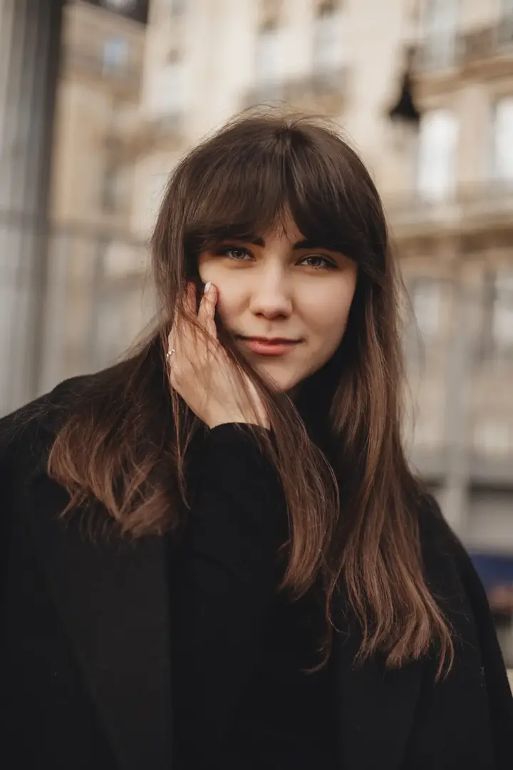 Close up woman portrait bangs Paris street